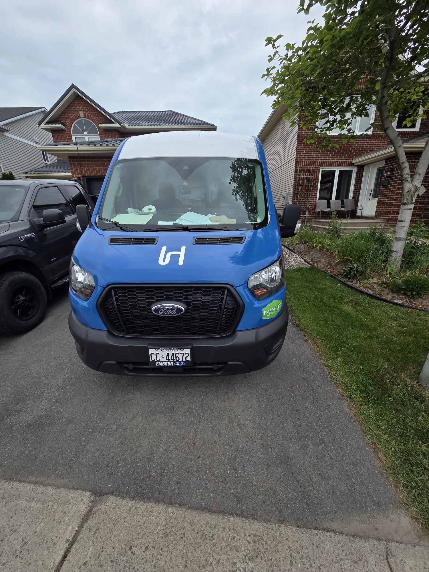 Front view of the blue Hydra Plumbing service van