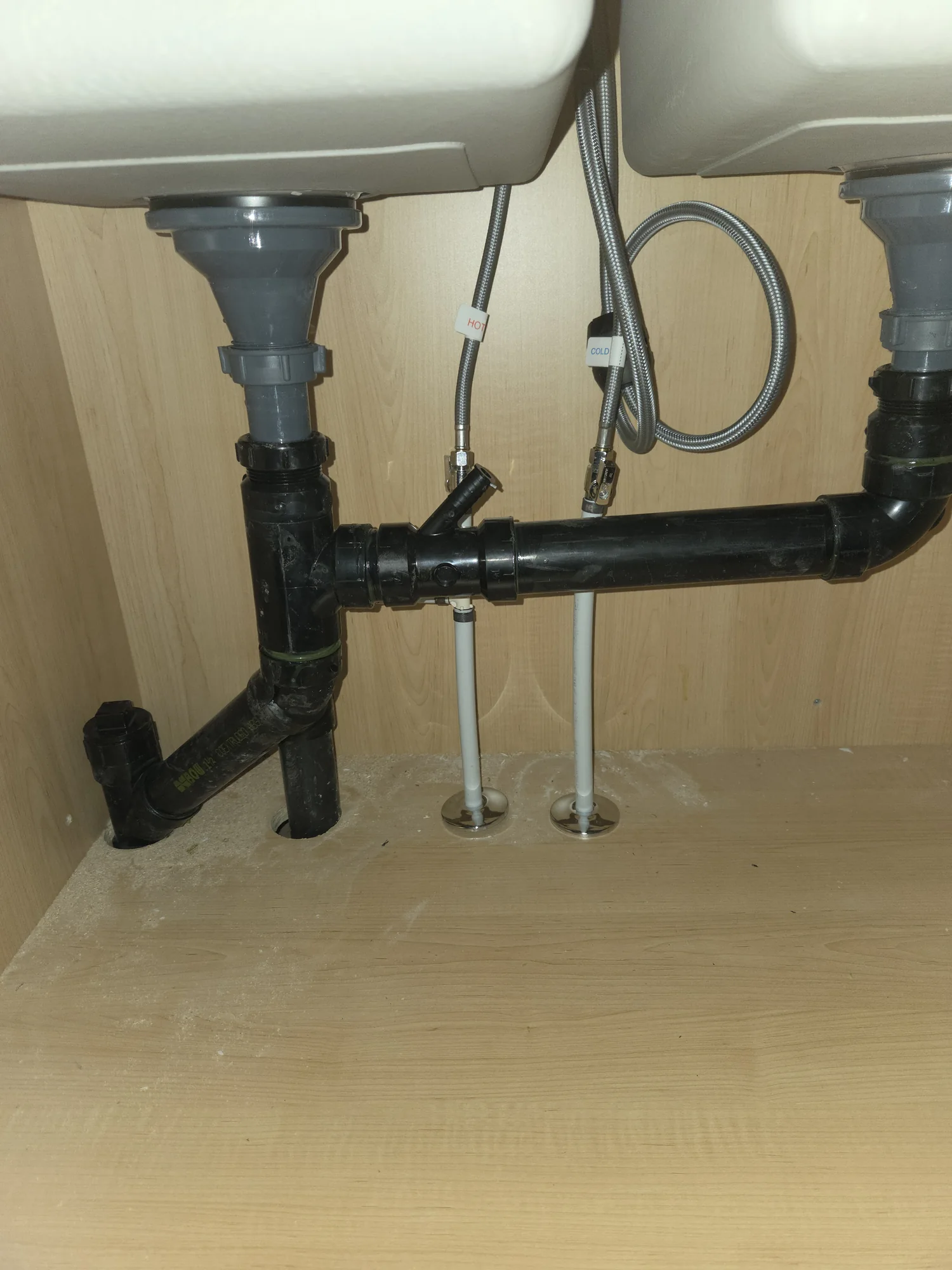ABS drain connections beneath a double kitchen sink