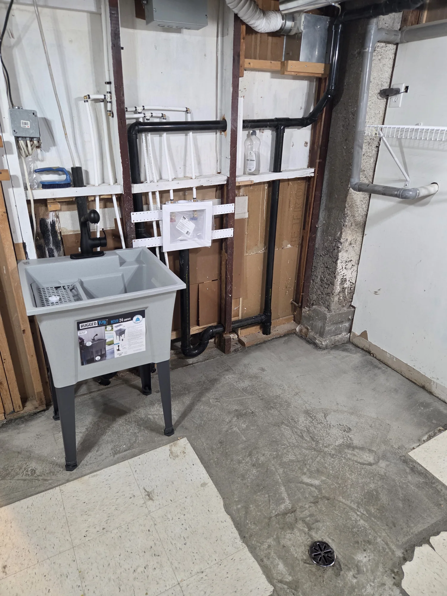 Laundry sink and washing-machine connection box in an open wall