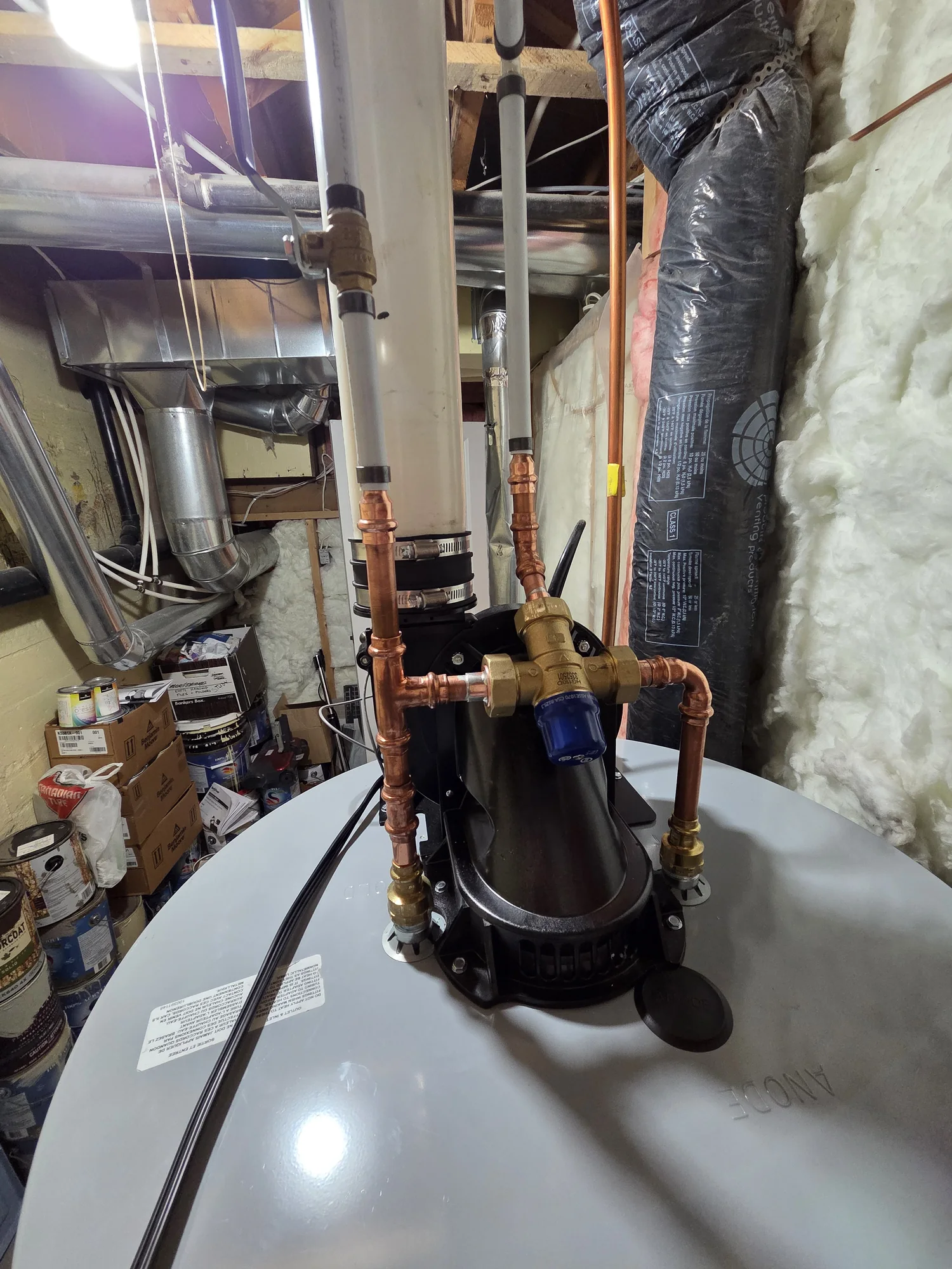 Power-vent assembly and water connections on a water heater