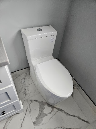 Freshly installed one-piece toilet by Hydra Plumbing