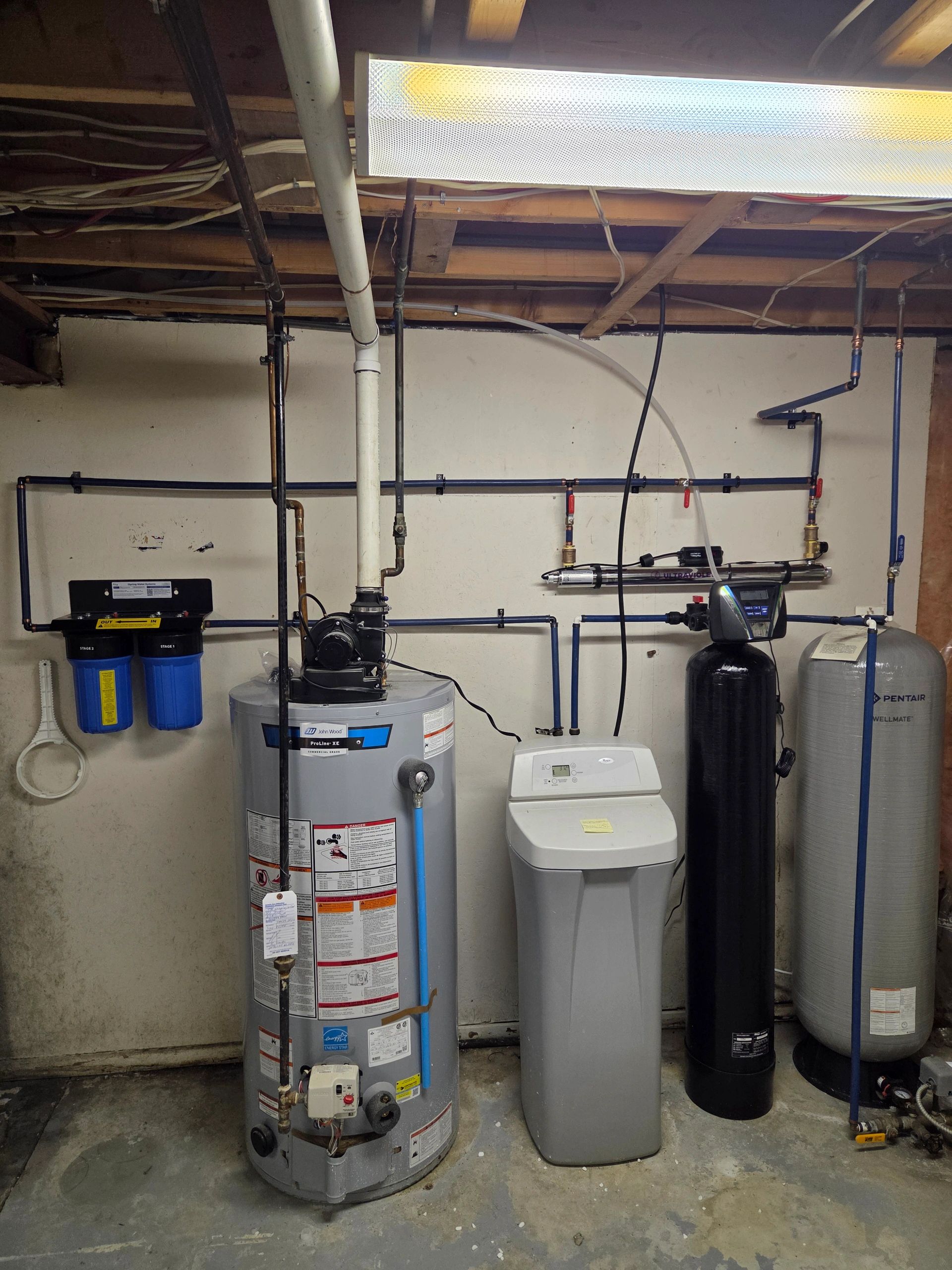 Water heater and treatment equipment in a finished mechanical room